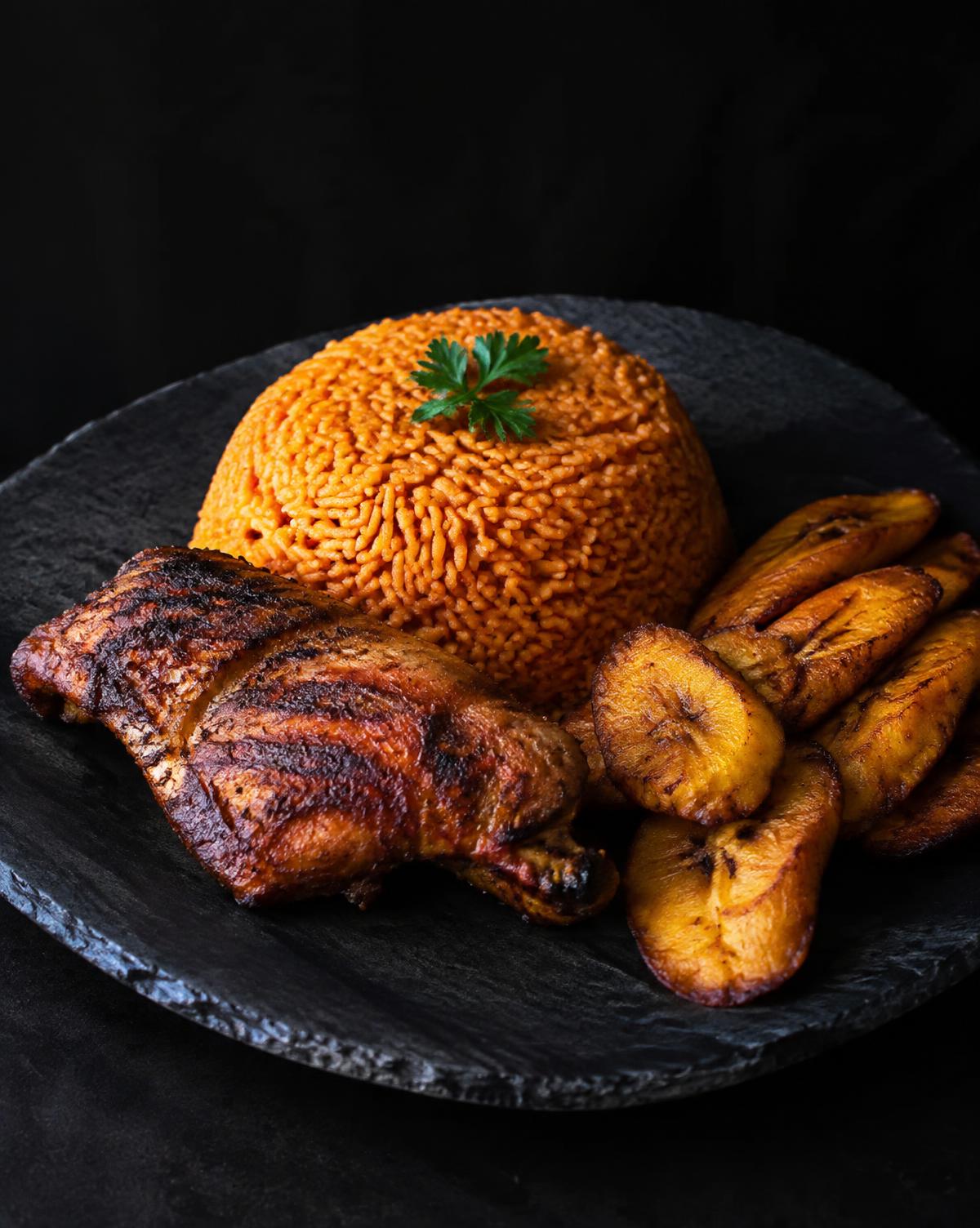 Jollof rice, grilled chicken and fried plantain